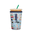 Insulated tumbler with a lid and straw in a patterned sleeve