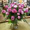 Pink roses arranged in a clear glass vase