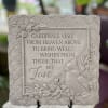 Square stepping stone that reads:
"Cardinals visit from heaven above to bring well