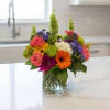 A lively celebration of color and texture, this flower arrangement is built