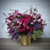 Luscious rich romantic colors and blooms gathered in a glamorous vase. Blooms