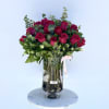 Bouquet of red roses in a clear glass vase
