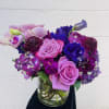 This beautiful lavender bouquet Has a variety of hydrangeas,roses, dahlias, roses, lisianthus