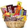 Basket filled with assorted candy bars and chocolate packs