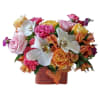 Colorful bouquet with roses, orchids, and alstroemeria in a textured square vase