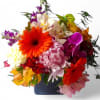 Vibrant blossoms of that day roses orchids and more arranged in a