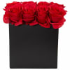 Red roses arranged in a black square box