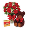 Red rose bouquet with a teddy bear and chocolate box