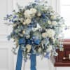 A beautiful floral tribute for the deceased. A lush palette of blue