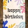 Birthday greeting card with black text and colorful abstract shapes on a white background