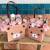 A set of 2 bear arrangement for mom and her baby. Roses