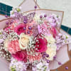 Pink and cream rose bouquet with lilac flowers and butterfly picks