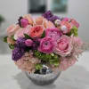 Pink and purple mixed bouquet in a silver vase