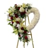 .A truly elegant funeral heart shaped stand, features white fluffy football mums
