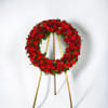 Honor a life beautifully lived with this elegant circular standing wreath, thoughtfully