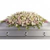 Pastel floral casket spray with pink and white blooms