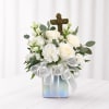 A serene, compact sympathy arrangement centered on soft white roses and carnations