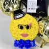 Yellow flower graduation face arrangement with balloons and a sign