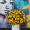 White XL vase with a lush arrangement of tall premium Florida sunflowers
