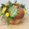 An acorn jar with fall flowers and a nice keepsake for years