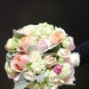 Bouquet of pastel roses and hydrangeas with silvery foliage