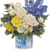 This breathtaking bouquet includes white spray roses, light blue delphinium, blue eryngium