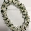 White dendrobium orchid and ti leaf 