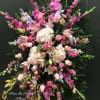 Large pink and white floral standing spray with lilies and roses