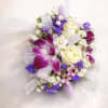This Beautiful corsage made with Purple dendrobium orchid and white spray roses