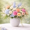 This beautiful and elegant arrangement, made with Hydrangea, ranunculus, Stuck, white dendrobium