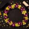 This lei made with yellow and purple dendrobium orchid 