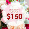 Designer’s choice flower bouquet with white and pink blooms