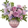 Lavender and pink bouquet in a textured pink vase
