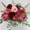 Elegant flower arrangement with red hydrangeas, roses, spray roses and mix of