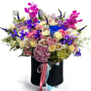 Large mixed bouquet in a black hatbox with pink and blue ribbons