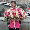 Large pink and white rose arrangement in a pink box