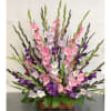 Basket arrangement of pink, purple, and white gladiolus flowers