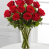 Bouquet of red roses in a clear glass vase