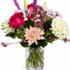 Mixed pink and white bouquet in a clear glass vase