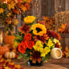 Fall bouquet with sunflowers, roses, and chrysanthemums in a black vase