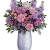 Pink and lavender flower arrangement in a tall silver vase