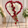 Heart-shaped red rose and white chrysanthemum standing spray on a tripod easel