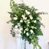 Classis sympathy spray of white Roses and Lillie&rsquo;s combined with sophisticated greenery.

