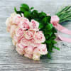 Bouquet of pale pink roses with a pink ribbon wrap