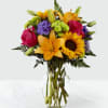 Bouquet of mixed flowers in a clear glass vase