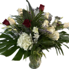 Bouquet of red and white roses with white hydrangeas in a glass vase