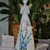 Decorative angel figurine with a dragonfly and mosaic accents