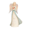 Angel figurine holding a pink heart