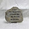 Engraved stone plaque with a garden quote on a stand