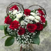 Bouquet of red roses and white baby's breath with greenery